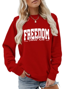 Detail of red Freedom Charlie Kirk sweatshirt featuring white bold text and date prints