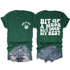 Detail of dark green cotton T-shirt showing front and back prints with skull hands graphics
