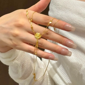Gold-plated double-layer necklace featuring 3D rose pendant and elegant fringe tassels