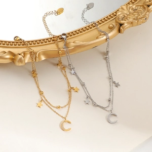 Double-layered gold and silver star anklet with sparkling crescent moon pendants