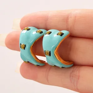Fashionable C-shaped stainless steel earrings with blue enamel and gold leopard print