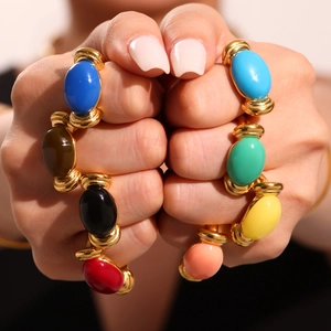 Colorful resin open rings set with vintage gold-plated finish on models hands
