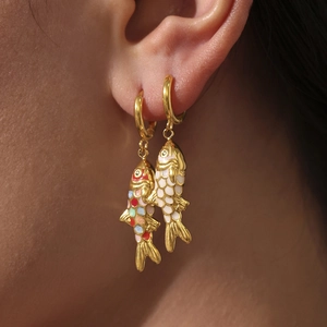 18K gold plated stainless steel koi fish earrings with colorful enamel details on model