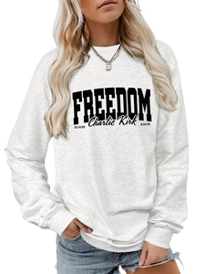 Detail of white cotton sweatshirt featuring black FREEDOM and Charlie Kirk lettering print