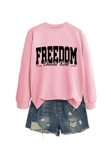 Detail of pink cotton sweatshirt with Freedom print and distressed denim shorts set