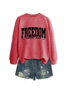 Detail of red Freedom Charlie Kirk sweatshirt paired with distressed denim shorts