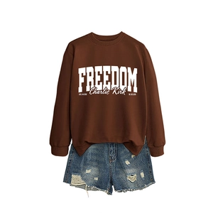 Brown Freedom Charlie Kirk sweatshirt with distressed denim shorts for autumn style