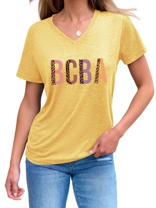 Detail of V-neck yellow T-shirt with leopard print BCBA lettering on soft fabric