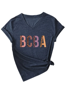 Close-up of the V-neck cotton T-shirt featuring BCBA leopard print patchwork design