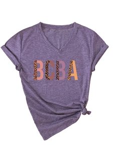Detail of purple V-neck T-shirt with BCBA leopard print letters and side knot hem