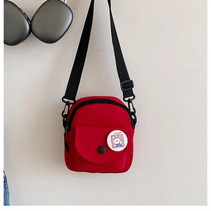 Mini red canvas crossbody bag for women with cute rabbit badge and adjustable strap