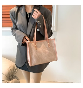 Retro nude pink suede tote bag for women with gold rivets and leather handles