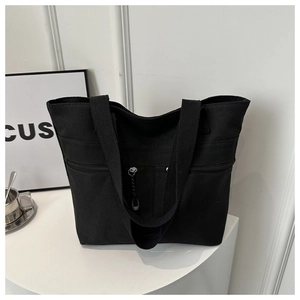 Sac fourre-tout en toile noire avec poche zippée fonctionnelle et doubles poignées de transport