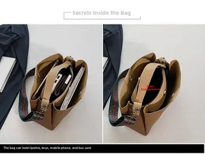 Brown vintage tote bag featuring a removable inner pouch and bohemian embroidered strap