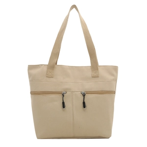 Sac cabas minimaliste en toile beige avec deux poches zippées devant et des poignées