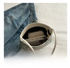Interior view showing capacity for a wallet and smartphone in striped canvas tote bag