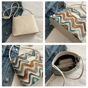 Detail view of large tote bag with striped jacquard pattern and spacious inner storage
