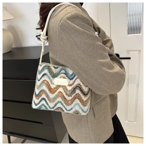 Detail of multi-color wavy knit wool bucket bag with JINGPIN logo and knotted strap