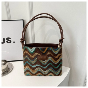 Detail of multi-color wavy pattern on retro bucket bag with JINGPIN leather label