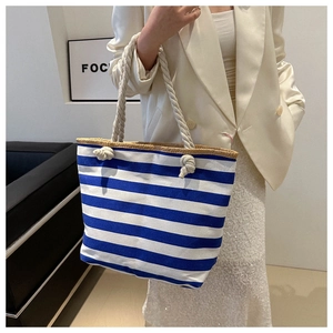 Detailed shot of large capacity blue striped canvas tote bag with thick rope handles