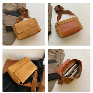 Macro detail of large brown faux suede tote bag showing spacious interior and wide strap