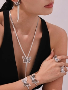 Exquisite silver-tone jewelry set with hollow butterfly motifs and marquise-cut zircons