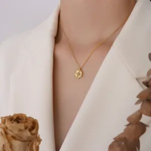 Chic gold-plated irregular round pendant necklace with starburst zircon on model