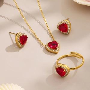 Luxury gold-plated jewelry set with heart-shaped red stones and sparkling diamonds