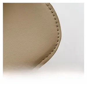 Close-up of fine lychee grain leather texture and precise stitching on khaki shoulder bag