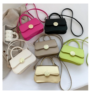 Group display of chic mini crossbody bags in six vibrant colors with metal twist locks