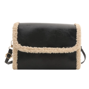Crossbody bag in black leather and beige faux fur trim with adjustable shoulder strap