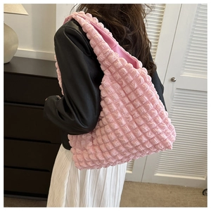 Pink puff pleated shoulder bag with 3D bubble texture fabric shown on model
