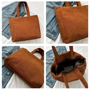 Close-up of brown corduroy tote bag showing large capacity and ribbed texture