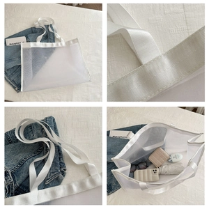 Detail view of white mesh tote bag showing large capacity for daily essentials