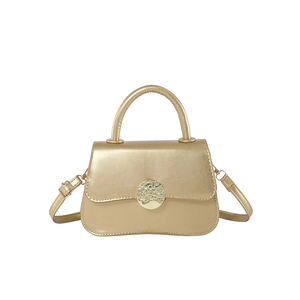 Elegant champagne gold handbag with metallic circular buckle and adjustable shoulder strap