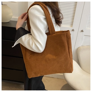 Brown corduroy tote bag showing vertical texture and large capacity for casual style