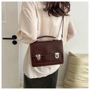 British style vintage brown messenger bag with top handle and crossbody strap