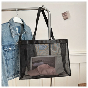 Close-up of black mesh tote bag showing transparent texture and large storage capacity