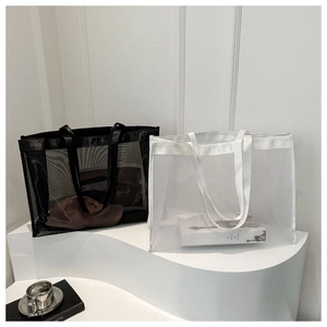 Minimalist large mesh tote bags in black and white colors for summer beach use