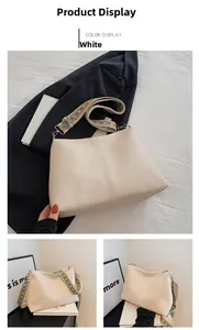 Close-up of cream leather tote bag with a colorful ethnic pattern wide strap