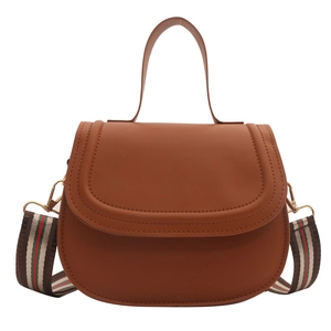 Chic caramel brown semi-circle saddle bag with adjustable striped wide shoulder strap
