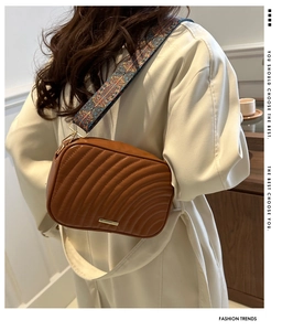 Brown quilted PU leather crossbody camera bag featuring a colorful ethnic wide strap