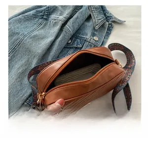 Brown quilted crossbody bag capacity display with retro print strap and wallet