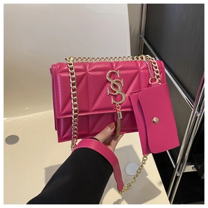 Detail of rose pink quilted PU leather bag with gold chain strap and double S logo