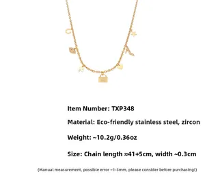 Macro detail of 18k gold plated necklace featuring star, heart and handbag charms