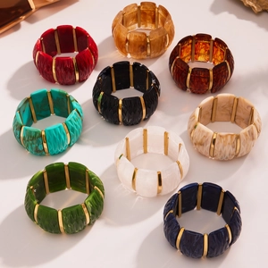Detailed top view of wide resin bracelets with gold stainless steel accents in multiple colors