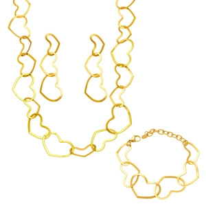 Luxe gold hollow heart jewelry set with necklace earrings and bracelet on white base