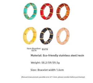 Detail view of 6 colorful resin bamboo-style bracelets with gold stainless steel spacers