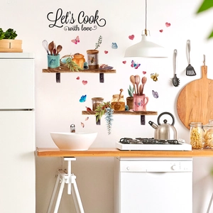 Dettaglio dell'adesivo murale cucina con barattoli ad acquerello e scritta Let's Cook with love