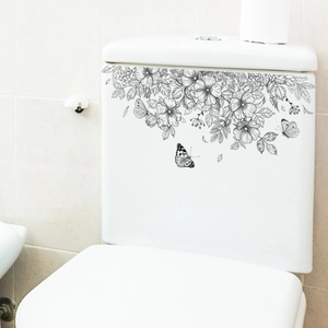 Floral butterfly wall decals in black line art on a white toilet tank for bathroom decor